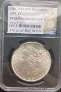 1896 NGC Brilliant Uncirculated Morgan $ With Original Bag Fragment.