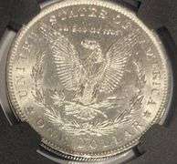 1884 O Brilliant Uncirculated Morgan $ NGC With Original Bag Fragment