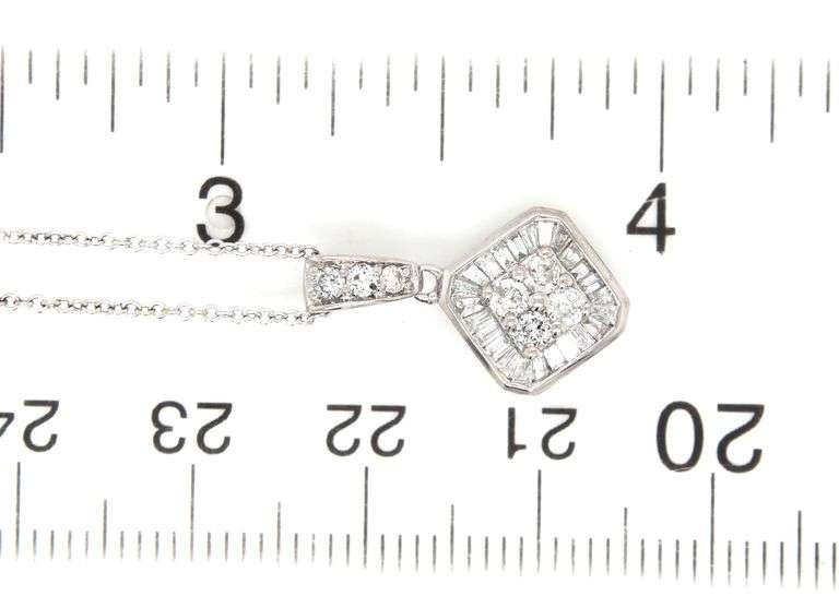 14kt White gold baguette and round diamond pendant on chain necklace