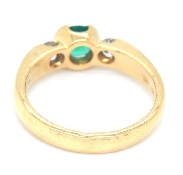18kt Yellow gold 0.45ct round emerald and diamond ring