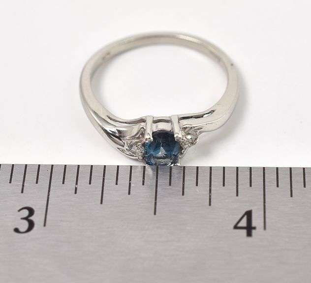 Elegant 10K White Gold Blue Topaz and Diamond Ring