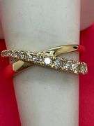LADIES BRAND 14K YELLOW GOLD DIAMOND CROSSOVER RING.