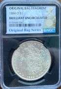 1884 O Brilliant Uncirculated Morgan $ NGC With Original Bag Fragment.