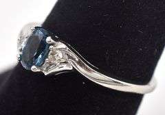 Elegant 10K White Gold Blue Topaz and Diamond Ring