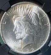 1922 NGC Brilliant Uncirculated Peace $ With Original Bag Fragment