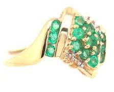 14kt Yellow gold emerald and diamond accent cluster ring