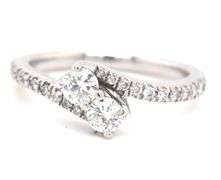 14kt White gold 0.75ctw bypass 2 diamond ring