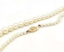 Graduated pearl strand necklace