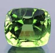 Superb 3.92ct cushion cut apple green Peridot