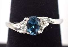 Elegant 10K White Gold Blue Topaz and Diamond Ring