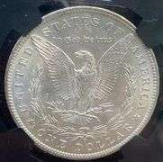 1884 O Brilliant Uncirculated Morgan $ NGC With Original Bag Fragment.