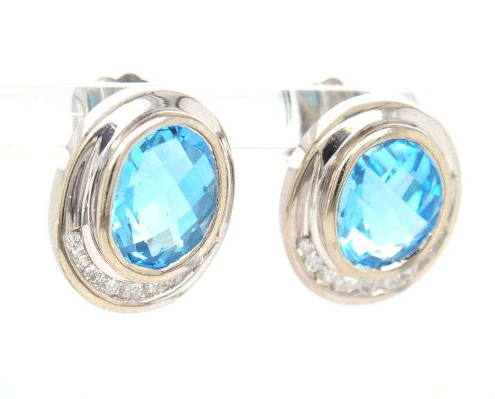 14kt White gold bezel set oval topaz and diamond half halo stud earrings