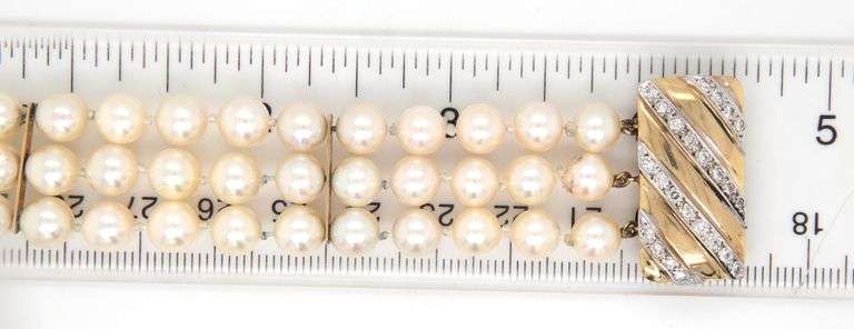 Triple row pearl diamond clasp bracelet in 14kt Yellow gold