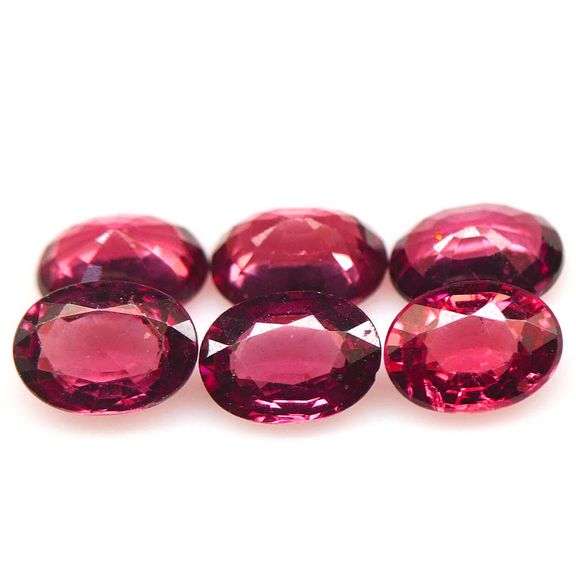 Remarkable 6.06ct violet pink Rhodolite Garnet set