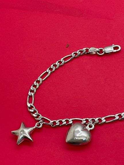 14K WHITE GOLD CHARM BRACELET.