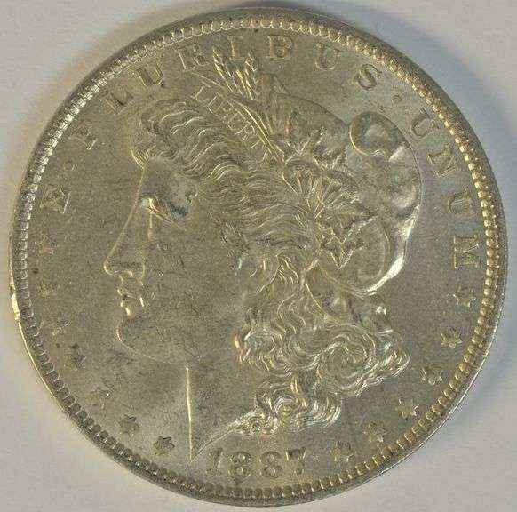 Frosty-white BU 1887-O Morgan Silver Dollar. Semi-key date