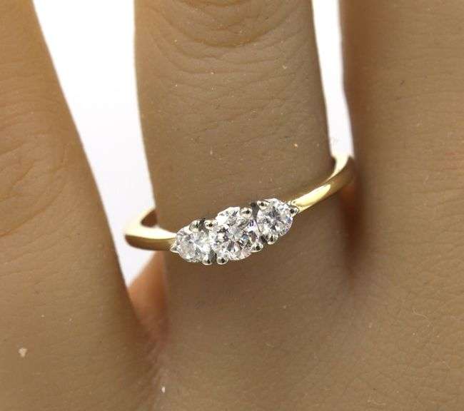 14kt Yellow gold round brilliant cut 3 stone diamond engagement ring