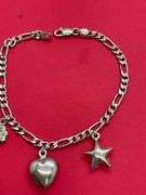 14K WHITE GOLD CHARM BRACELET.