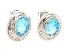 14kt White gold bezel set oval topaz and diamond half halo stud earrings