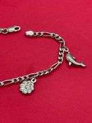 14K WHITE GOLD CHARM BRACELET.