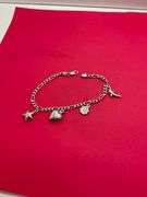 14K WHITE GOLD CHARM BRACELET.