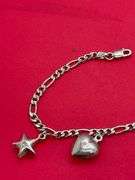 14K WHITE GOLD CHARM BRACELET.