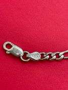 14K WHITE GOLD CHARM BRACELET.