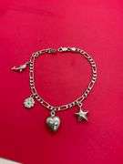 14K WHITE GOLD CHARM BRACELET.