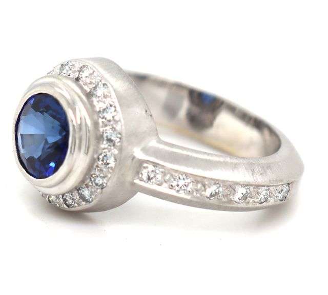 18kt White gold bezel set blue sapphire and diamond ring