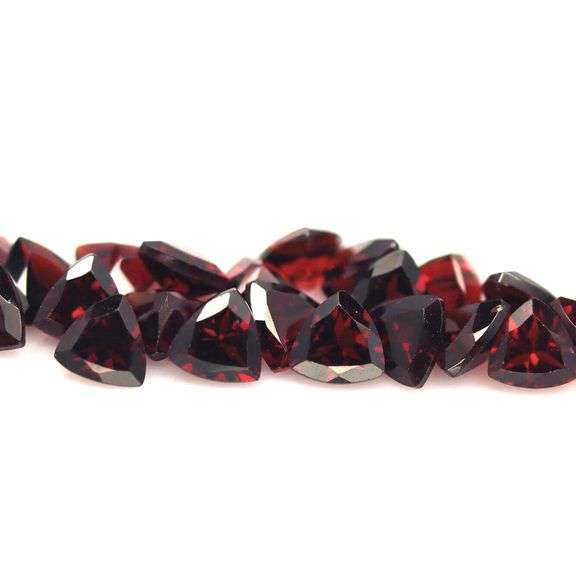 Deep burgundy 14ct trillion cut untreated Garnet set