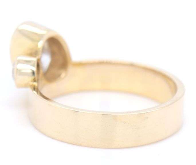 14kt Yellow gold oval and round Moissanite bezel set wide ring