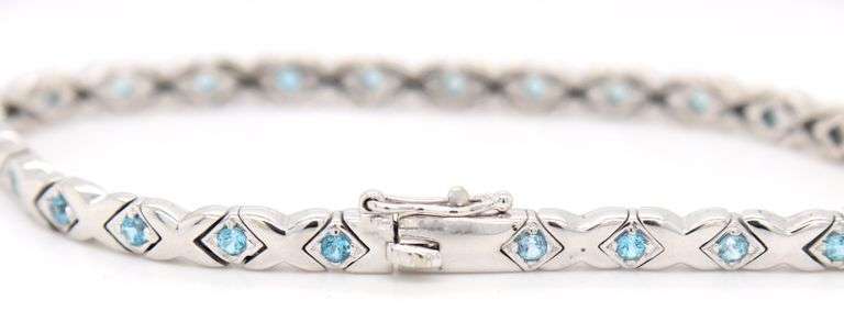 14kt White gold blue topaz X link bracelet
