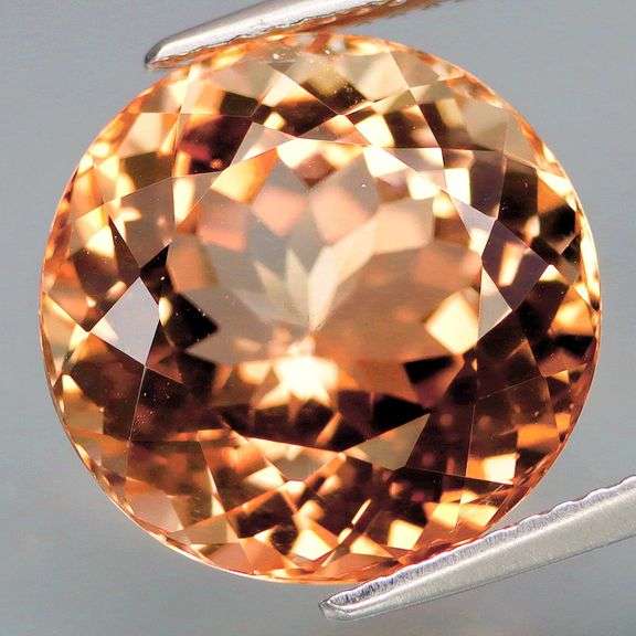 Substantial heavy flashing 11.61ct Brazilian imperial Topaz