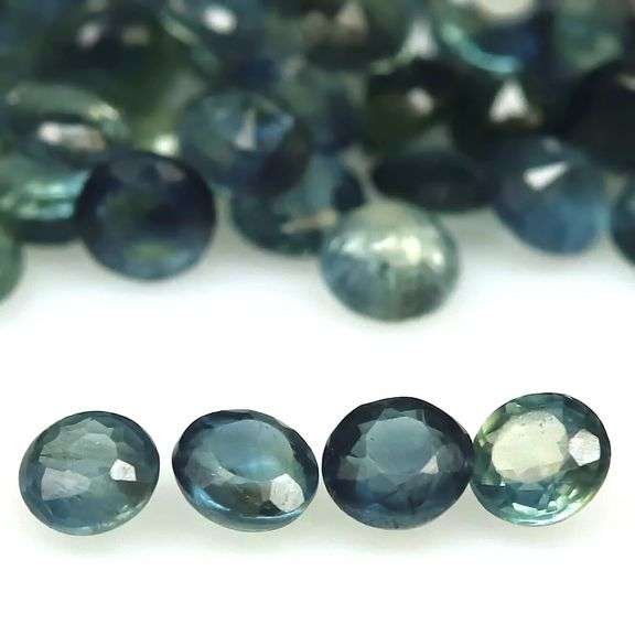 Stunning blue green 5.91ct round cut Sapphire set