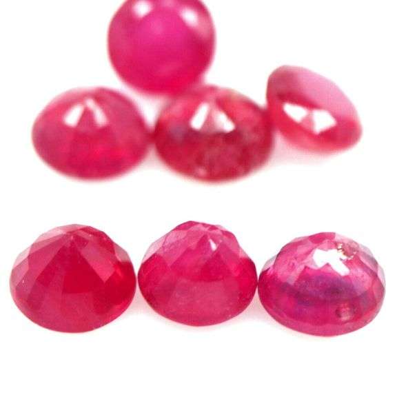 Vibrant 8.12ct round cut imperial red Ruby set