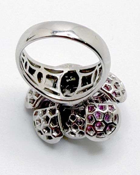 Hand made Italian 18kt white gold diamond and natural ruby articulated flower ring