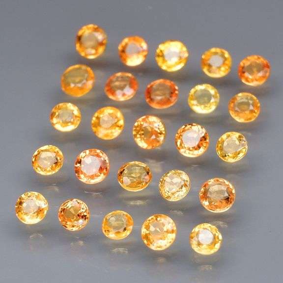 Large 4.40ct round cut yellow and orange Sapphire set! Eye clean!