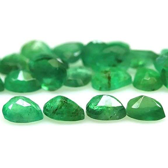 Pear cut 6.56ct Zambian Emerald set