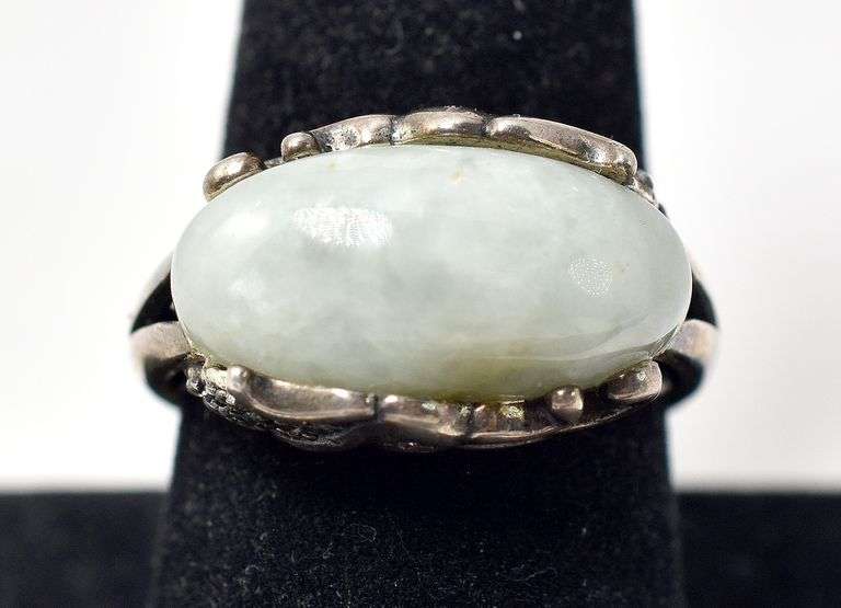 Unique Ring with Light Green Stone and Intricate detailing on Housing in Sterling Silver 8grams Size