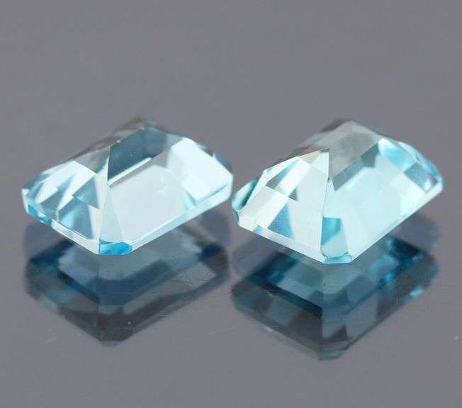 Dazzling 10.02ct vivid blue emerald cut Topaz pair