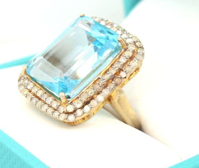 Bewitching Large 9.13CTS Emerald Cut Blue Topaz & Diamond ring in 14K Yellow Gold Over Sterling Silv