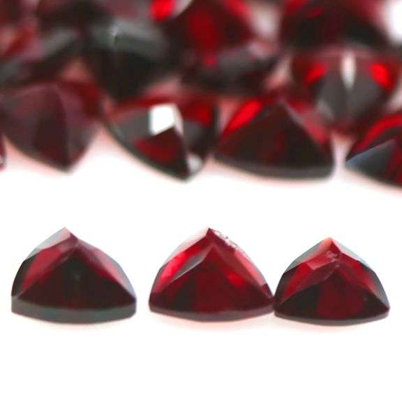 Deep burgundy 14.10ct trillion cut untreated Garnet set