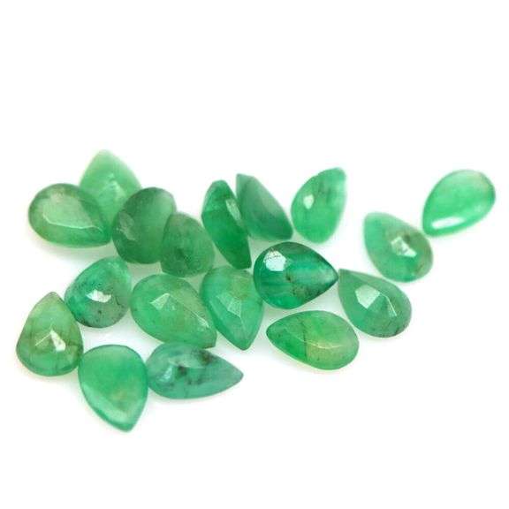 Pear cut 6.31ct Zambian Emerald set