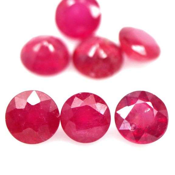 Vibrant 8.12ct round cut imperial red Ruby set