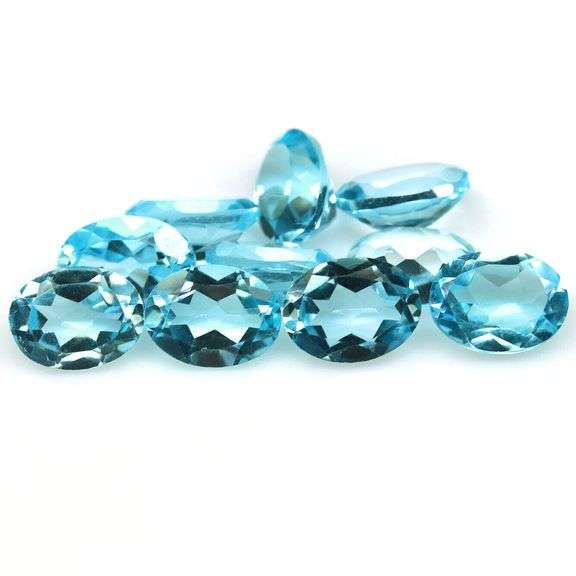 Bright 14.24ct sky blue Topaz set
