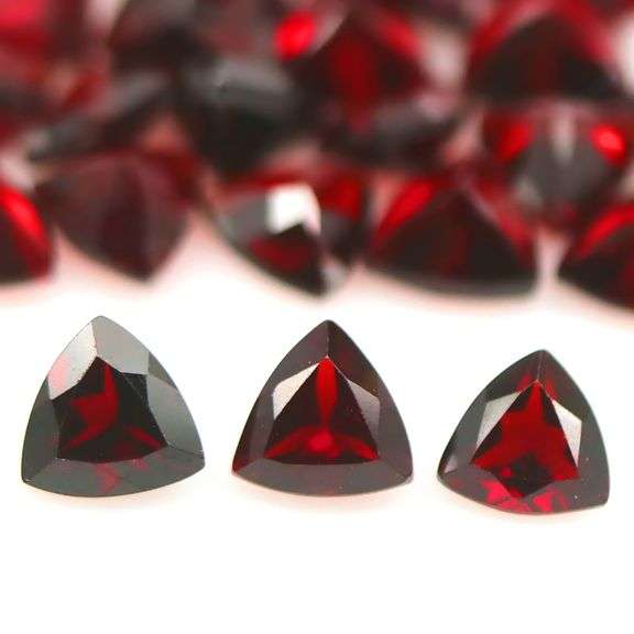 Deep burgundy 14.10ct trillion cut untreated Garnet set