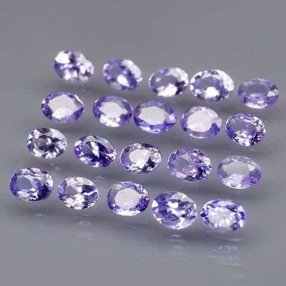 Heavy flashing 2.88ct oval cut Tanzanite set