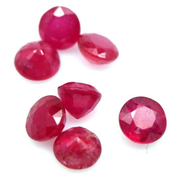 Vibrant 8.12ct round cut imperial red Ruby set