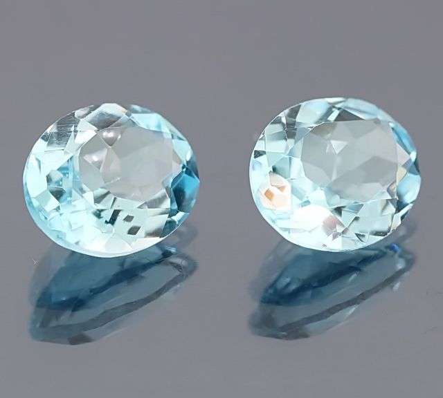Heavy 10.55ct vivid sky blue Topaz set