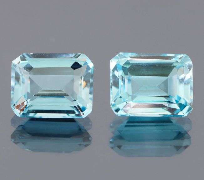 Dazzling 10.02ct vivid blue emerald cut Topaz pair